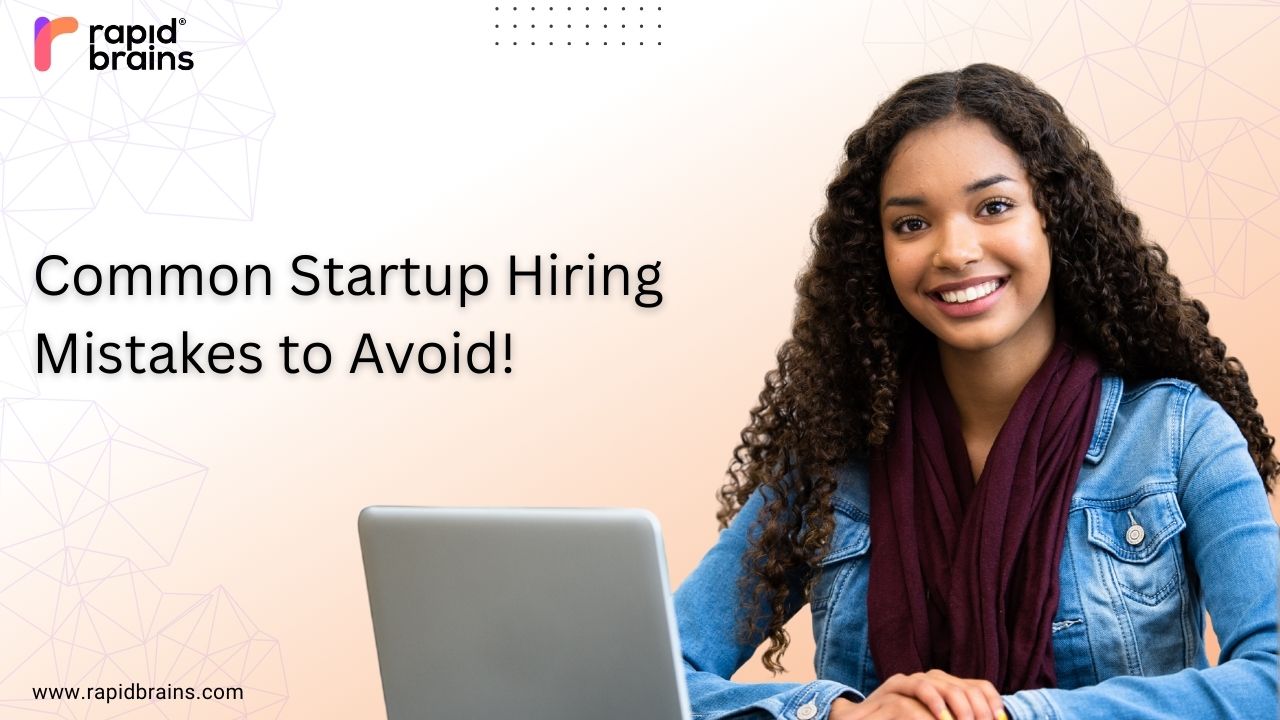 Professional smiling woman working on a laptop with the title “Common Startup Hiring Mistakes to Avoid” and RapidBrains logo